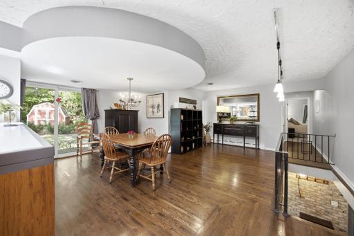 The dining area offers a gorgeous open space with hardwood floors and a walk-out patio door leading to the backyard.