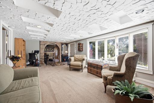Gorgeous natural lighting and a brick archways add so much character to this space.