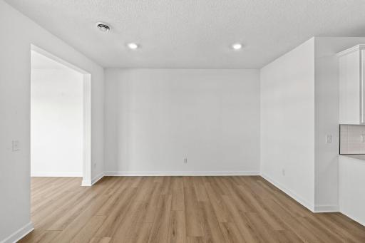 The dining room is located among the open floorplan, allowing effortless flow between rooms.