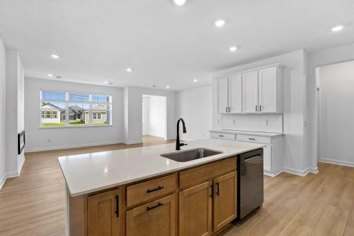 A designer faucet complements the stainless steel undermount sink