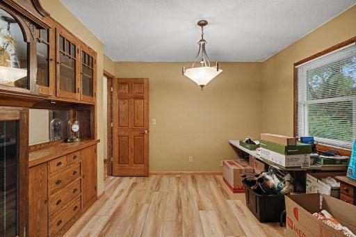 Formal dining room has glass, pocket French doors. Doors are six panel sold doors