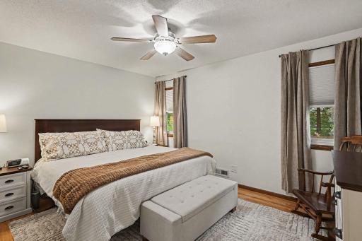 Upper level bedroom with hardwood floors and fresh paint