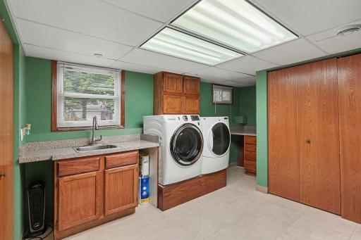 Laundry room offers ample room for storage. New water softener, New water heater, and newer HVAC