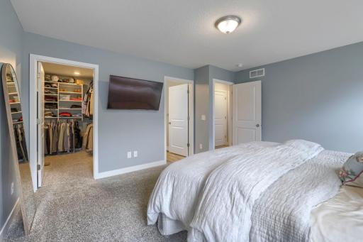 Primary Bedroom with Built In Cabinets in the Closet