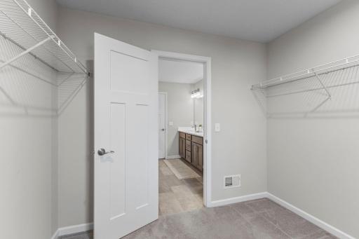 Alternate view of closet towards primary bathroom.