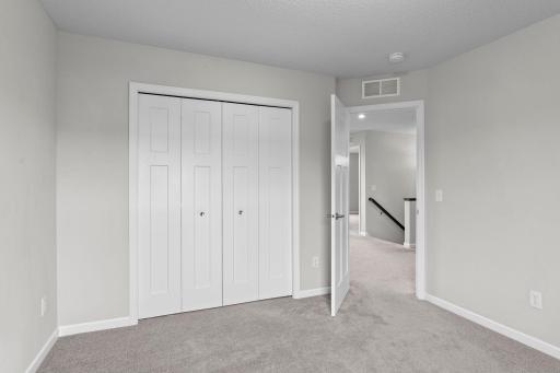 Alternate view of large closet and door to hallway.