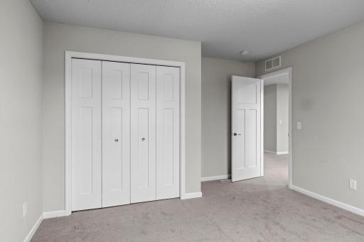 Alternate view of large closet and door to hallway.