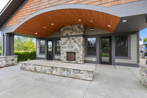 Beautifully maintained common areas feature pergola-covered seating, walking paths, mature landscaping, and multiple places to gather outdoors.