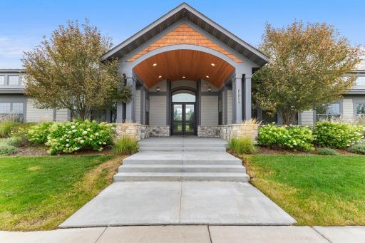 Community kitchen features abundant cabinetry, expansive counter space, stainless steel appliances, and a pass-through to the gathering roomâperfect for resident events and entertaining.