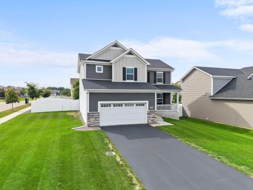 Welcome to 18097 Hartlin Ave! Beautiful curb appeal, modern exterior finishes, an inviting covered front porch, and a spacious two-car garage make a great first impression.