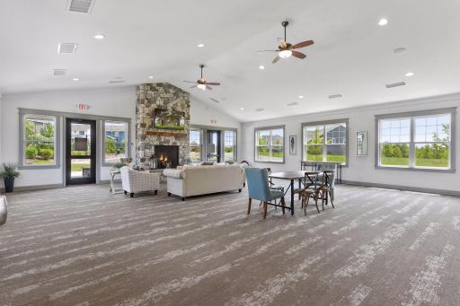 Spacious community gathering room offers plenty of room for residents to relax, socialize, and entertain, complete with a beautiful stone fireplace and flexible seating areas.