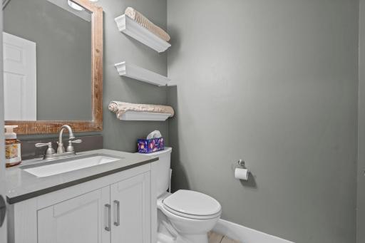 A mudroom that earns its keep, with durable tile flooring, organized closet storage, and a connected half bath. A great drop zone for shoes, bags, jackets, and any other outdoor gear.
