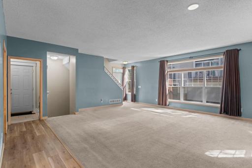 Tall ceilings, oversized windows, and natural light throughout the main level.