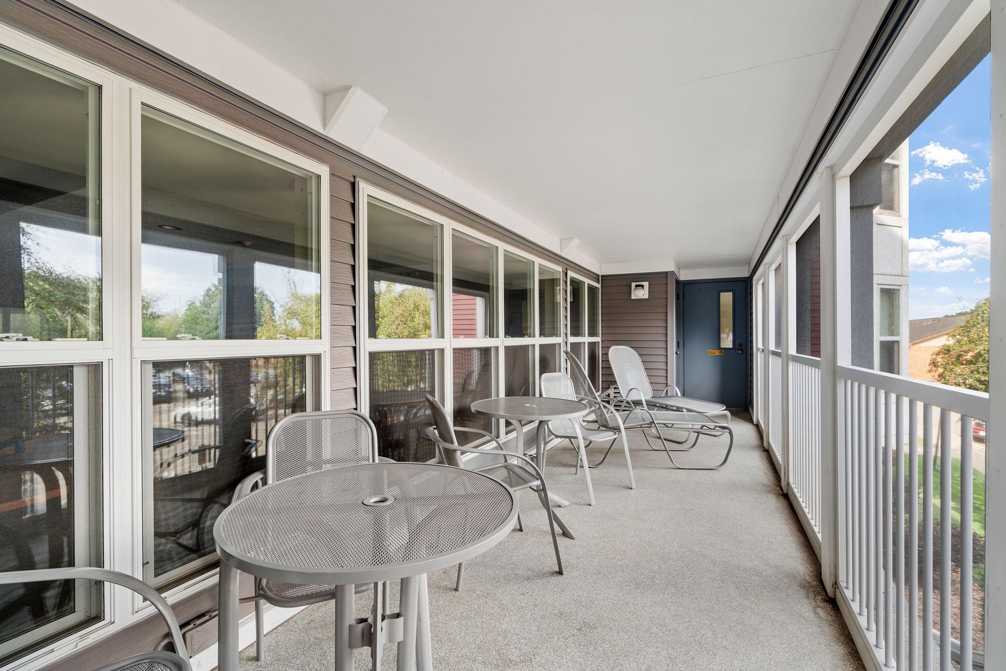 Enjoy the shared community porch, a welcoming space to relax and enjoy the outdoors