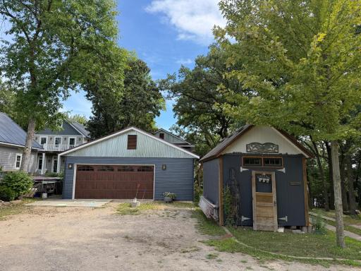 The property has a 2-car detached garage which is insulated and heated, 3 storage sheds and a boat house.