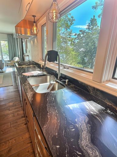 Gorgeous counter tops, stainless-steel sink and an over the sink window, so you will never have to miss the view.