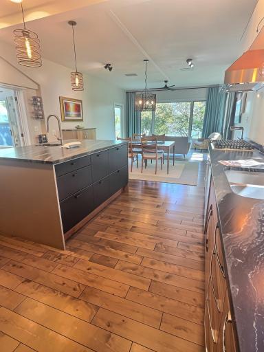 Once again, 3/4 inch hardwood flooring and an expansive center island with pre-sink and soft closing cabinets and drawers on both sides.