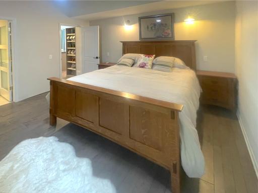 The main floor bedroom is also 3/4 inch hardwood floor. Partial vaulted ceiling creates a light and airy feel to the room.