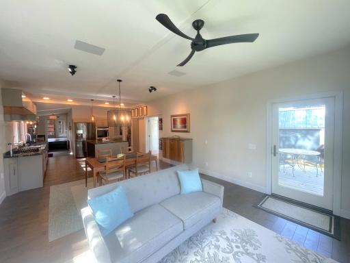 The open floor plan creates an ideal space for hosting gatherings. Hardwired speakers let music lovers enjoy their favorite tunes both indoors and outdoors.