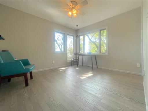 Third bedroom featuring large, beautiful windows. This bedroom also has a large walk-in closet.