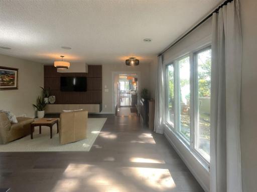 The first look of the interior gleams radiantly with natural light. The stunning 3/4 inch wood flooring is one of the several types of wood and finishes throughout the home. TV Speakers are hard wired for a nice clean look. No more cords all over.