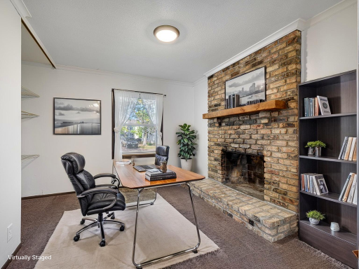 The second bedroom is virtually staged as an office.