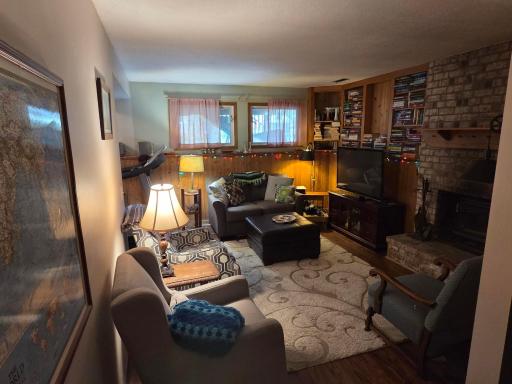 Family Room lower level with wood burning Brick Fireplace!