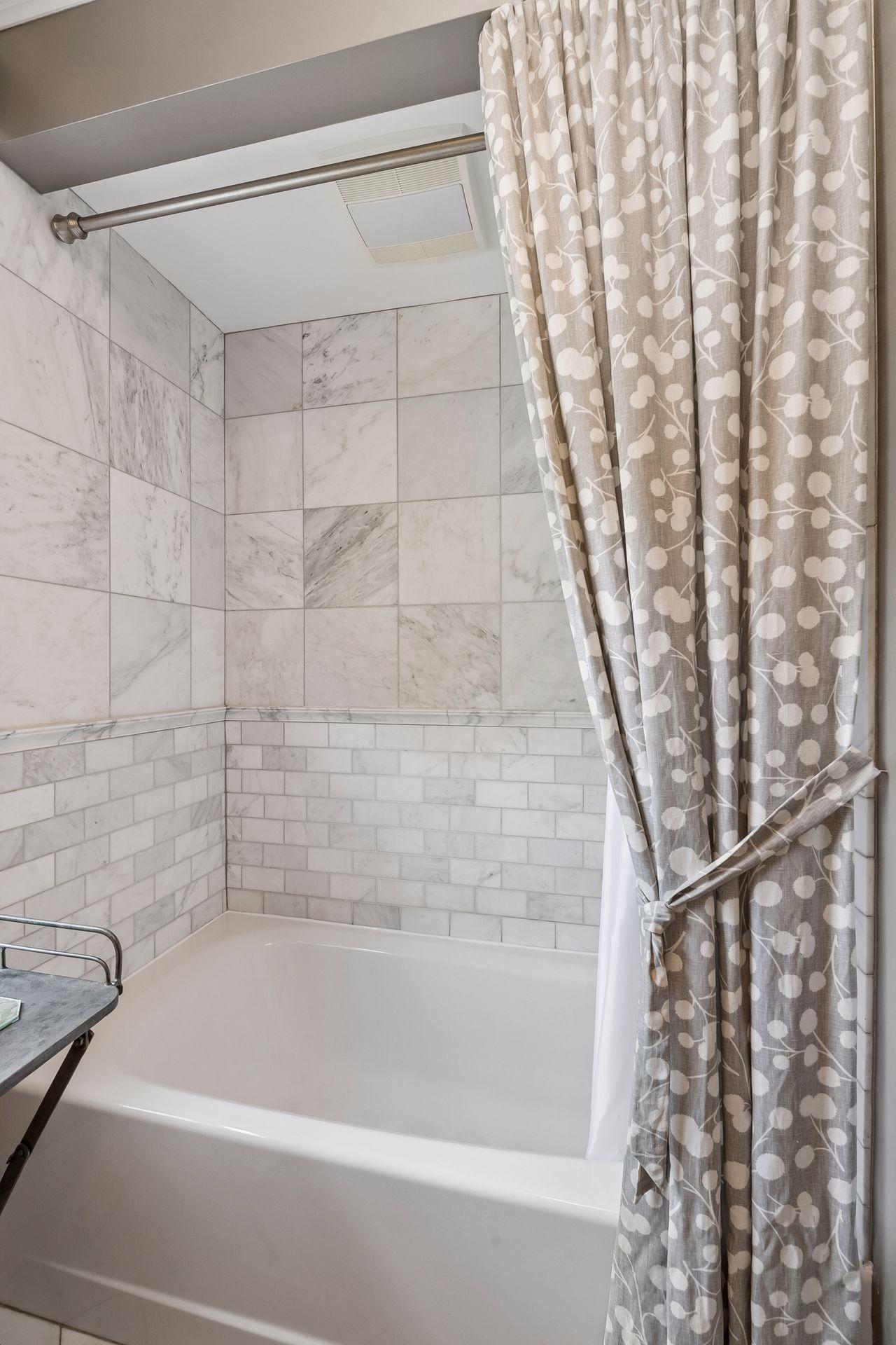 Amazing stone and tile bathroom tub and shower surround.