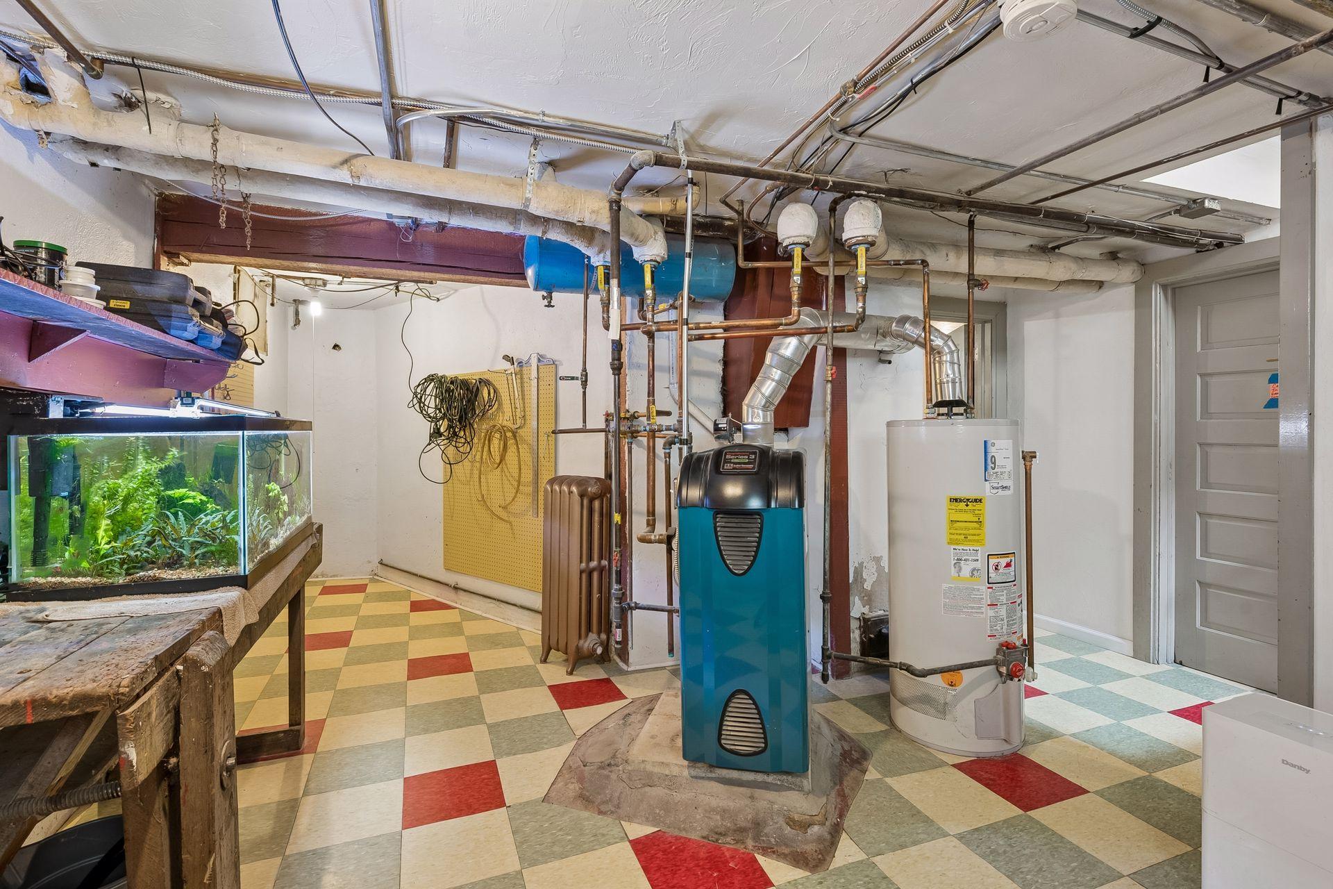 New boiler in 2015. Basement walls have sheet rock and the floor is tiled.
