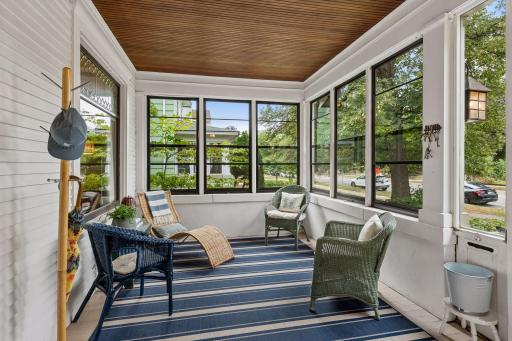 A huge front 3-season porch offers a wonderful place to relax and enjoy the seasons.