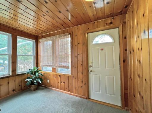 Front porch with knotty pine walls & ceiling