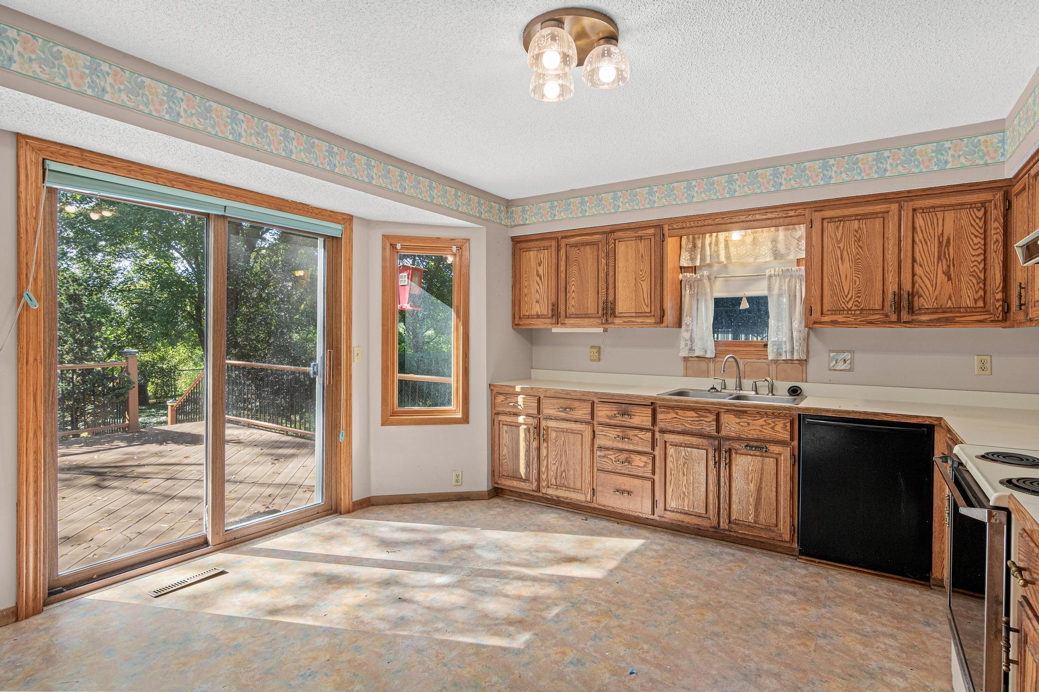 Kitchen w/ Sliding Door onto Backyard Deck