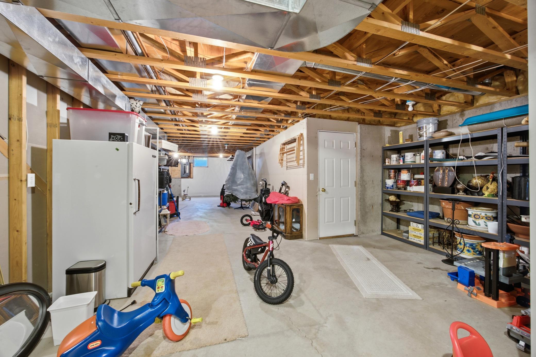 Lower level storage with a garage access