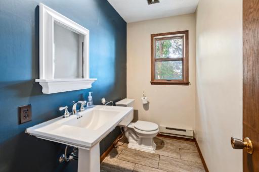 Main floor half bathroom off garage is practical