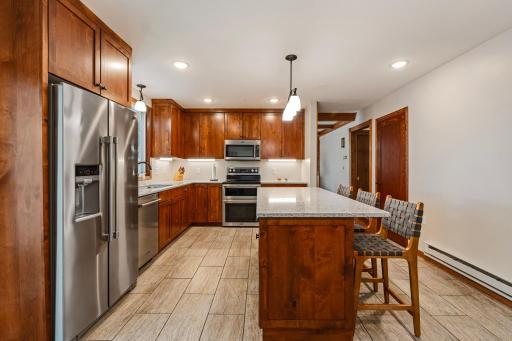 Great tile floors and floor to ceiling new cabinetry