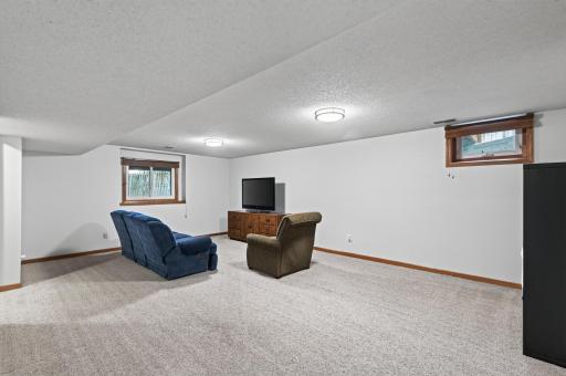 Cozy family room with new carpet installed in 2023.