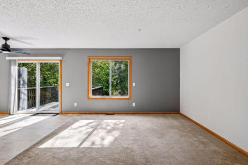 Sliding door leading out to the deck. Beautiful private view in the back of the house!