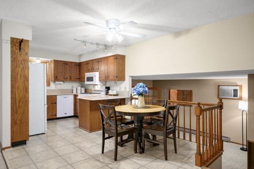 Plenty of cabinetry and counter space, a gas stove and peninsula with additional seating.