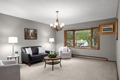 The spacious Living Room features a large bay window and plenty of room to gather.
