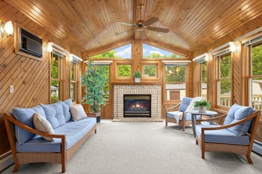 Vaulted wood ceiling, walls of windows and a Gas Fireplace create a room you'll want to enjoy year-round.