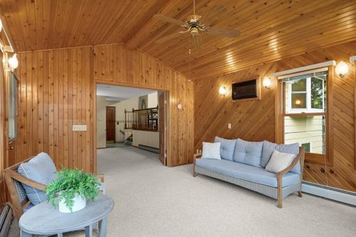 Warm woodwork, a vaulted ceiling, Gas Fireplace and windows all around make this a standout space.