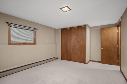 Lower-level bedroom with a large closet and plenty of room to make it your own.