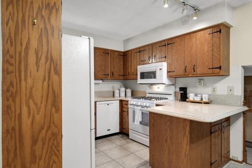 Plenty of cabinet and counter space, plus a breakfast bar for casual meals or extra seating.