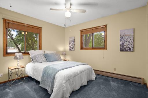 Generously sized bedroom with windows on two sides bringing in plenty of natural light.