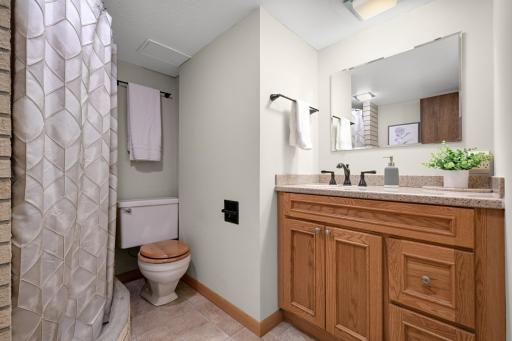 3/4 bath in the lower level has an updated vanity.