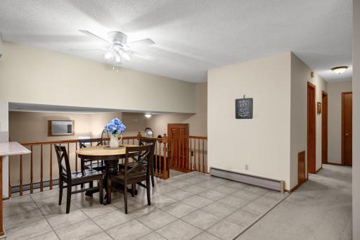 Dining space just off the Kitchen with room for a full-size table and an open view to the level below.