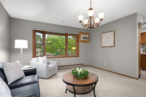 Spacious Living Room with a large bay window overlooking the yard.