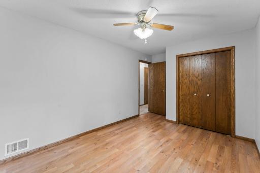 Spacious lower 3rd bedroom with look out windows! Clean, neutral palette and standout flooring!