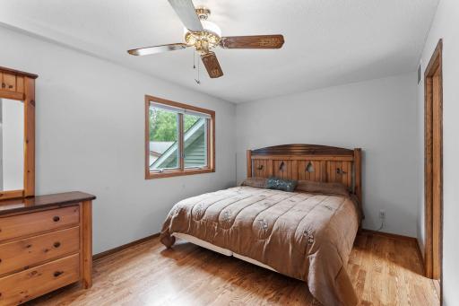 The primary bedroom features a walk-in closet and convenient walk-through bathroom with tiled flooring and a tiled tub/shower.