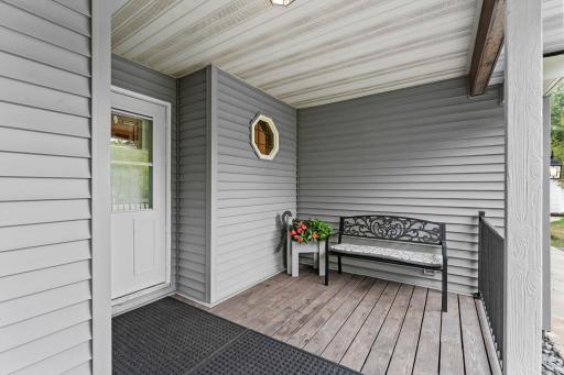 Large front porch. Nicely landscaped yard and mature trees.